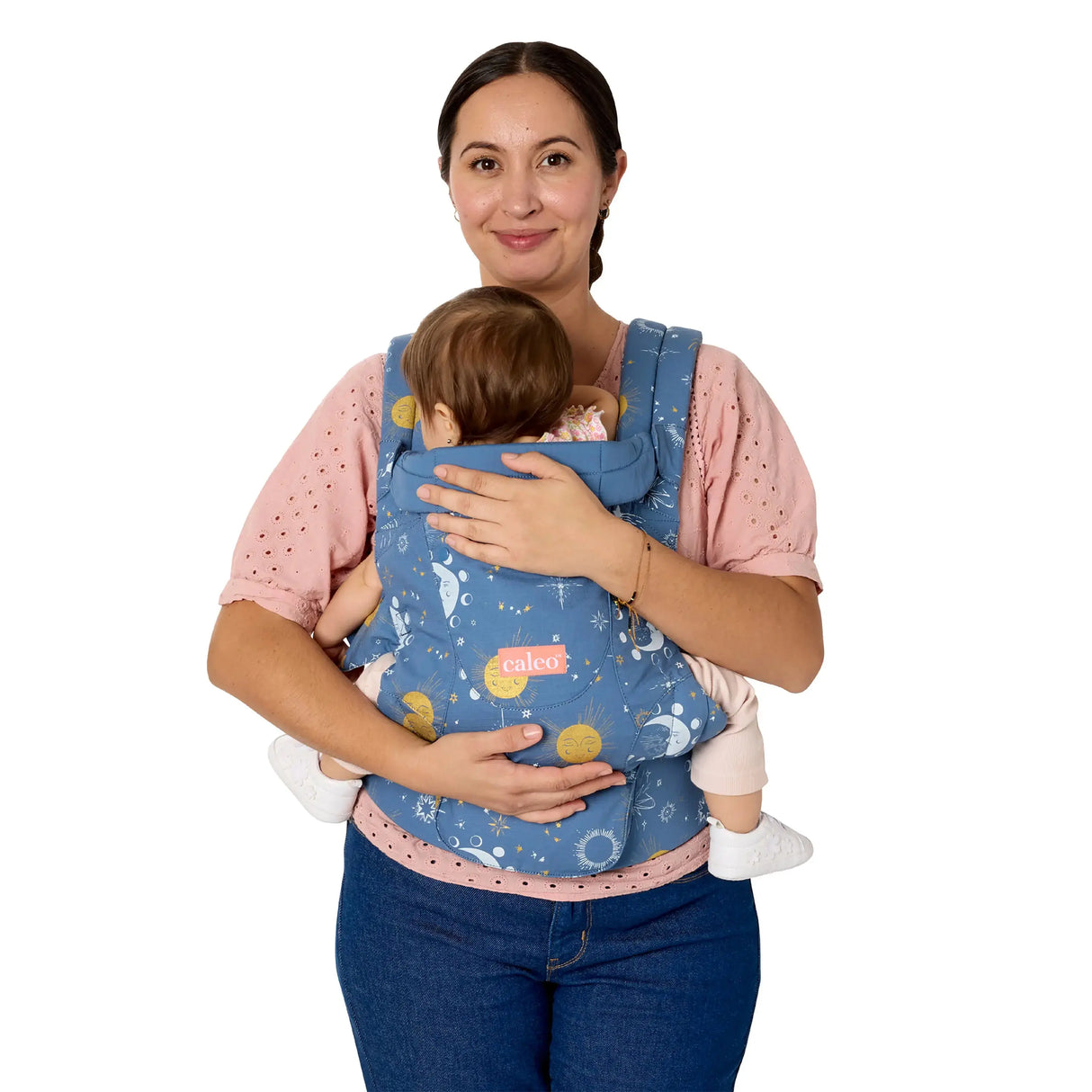 A mom is carrying her child in the Baby Trend Newborn Carrier