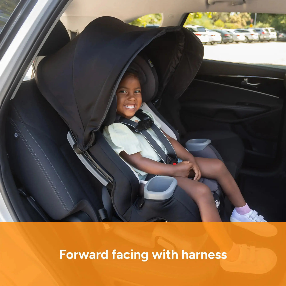 Toddler forward facing with harness of the Baby Trend Cover Me 4-in-1 Convertible Car Seat