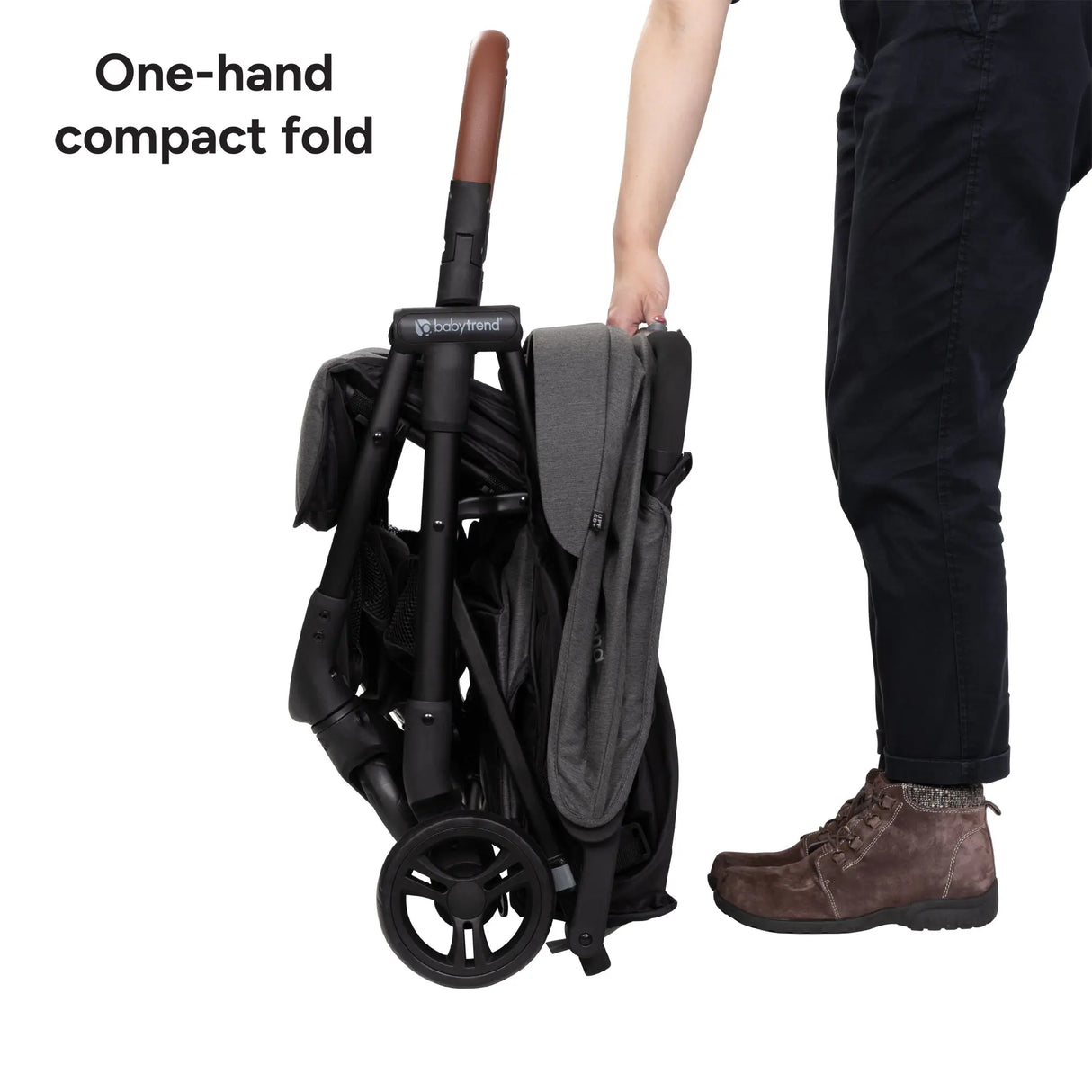 Baby Trend York Compact Side-By-Side Double Stroller compact folding stroller being held by a person