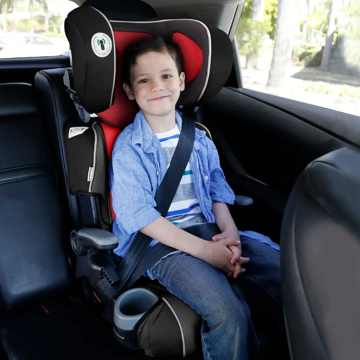 A young child sitting in the Baby Trend PROtect 2-in-1 Folding Booster Car Seat