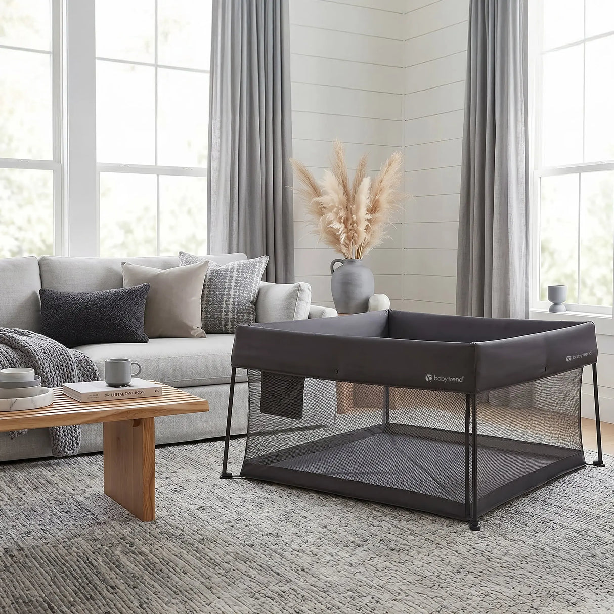 The Baby Trend Play Zone Play Space is inside a living room of a family home