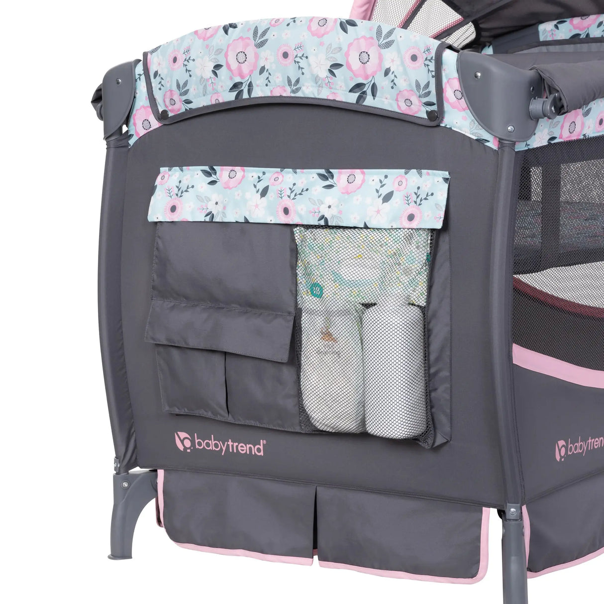 The storage compartments on the side of the Baby Trend Deluxe II Nursery Center Playard