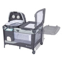 Load image into gallery viewer, The changing table flip away on the Baby Trend Nursery Den Playard with Rocking Cradle