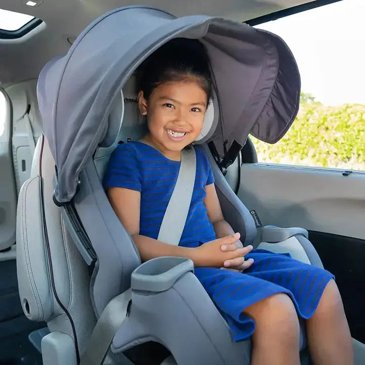 A child is sitting in forward facing mode with the Baby Trend Cover Me Convertible Car Seat