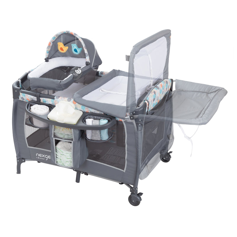 Flip away changing table of the NexGen by Baby Trend Dreamland Nursery Center Playard