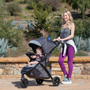 Load image into gallery viewer, Baby Trend Tango 3 All-Terrain Stroller with mother and child enjoying the outdoor