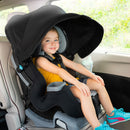 Load image into gallery viewer, Toddler girl sitting in the Baby Trend Cover Me 4-in-1 Convertible Car Seat