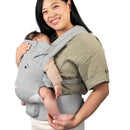 Load image into gallery viewer, A mom carrying her child with the Caleo 3-in-1 Newborn Carrier