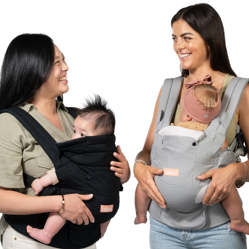 Two moms with their children using the Caleo 3-in-1 Newborn Carrier