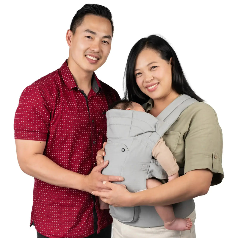A parents using the Caleo Charm Deluxe 3-in-1 Newborn Carrier to carry their baby