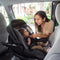 A mom is placing her child in the Baby Trend EZ-Lift PLUS Infant Car Seat