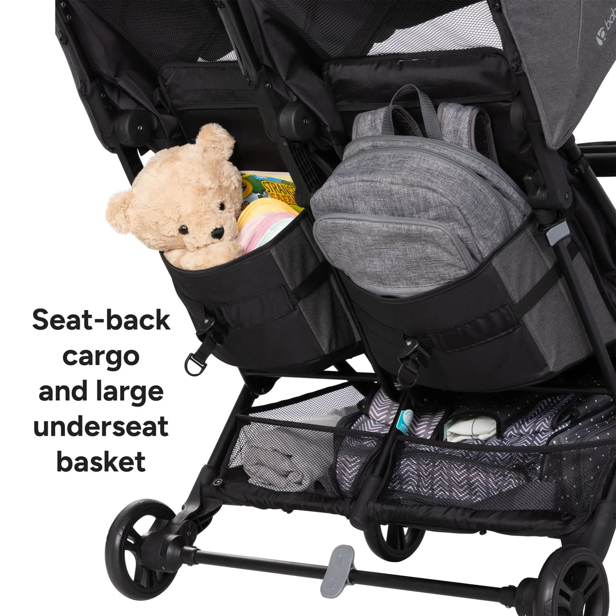 Baby Trend York Compact Side-By-Side Double Stroller with seat-back cargo and large underseat basket, featuring a teddy bear and backpack.