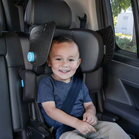 Child sitting in a Baby Trend PROtect SLIM PLUS Booster Car Seat with Side Sun Visors in a vehicle.