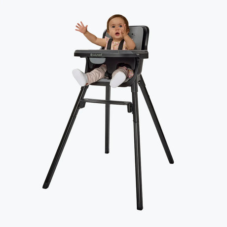 A child sitting in the Baby Trend Sweet Seat 4-in-1 High Chair