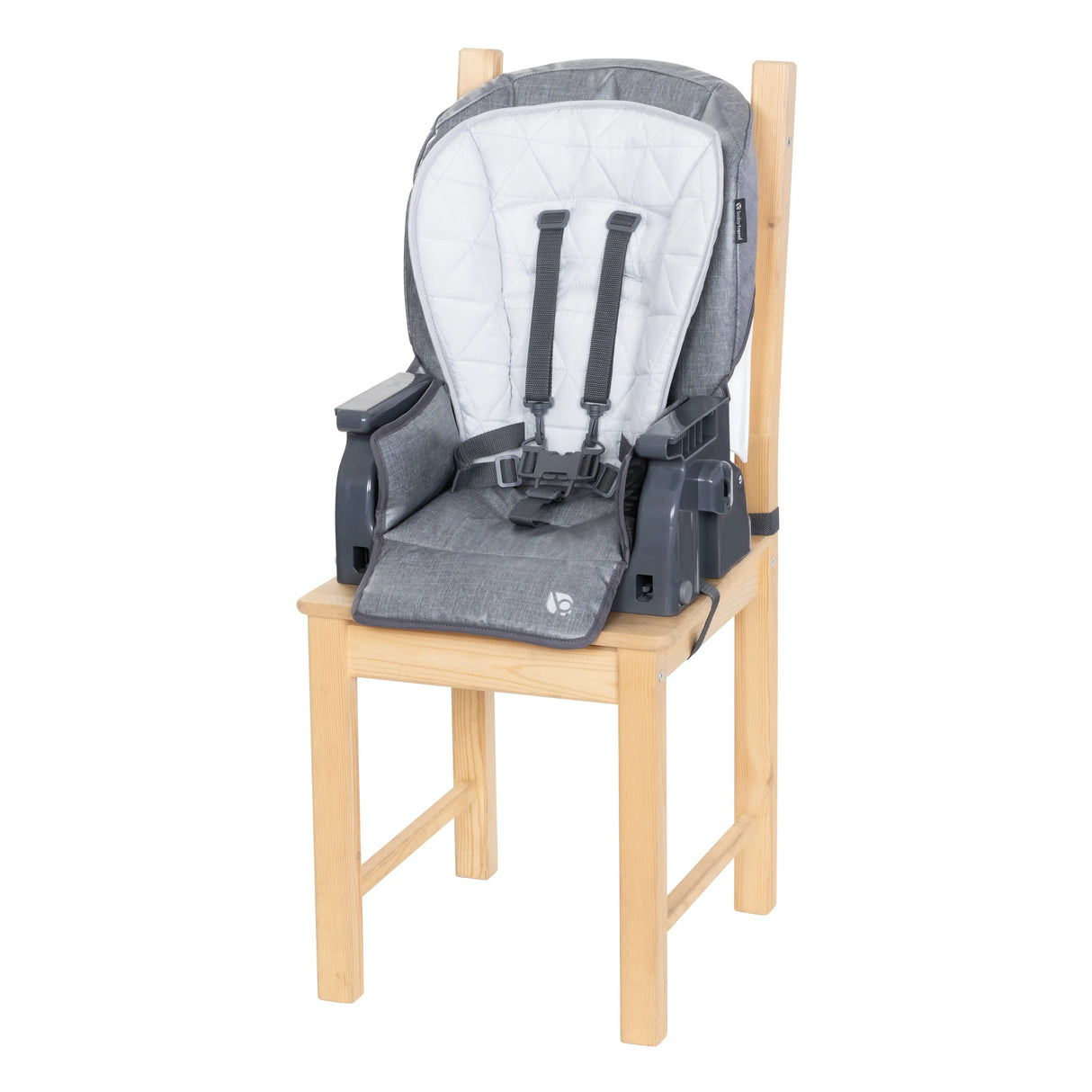 Toddler mode with the seat of the 7-In-1 Feeding Center High Chair removed and placed on a dining chair