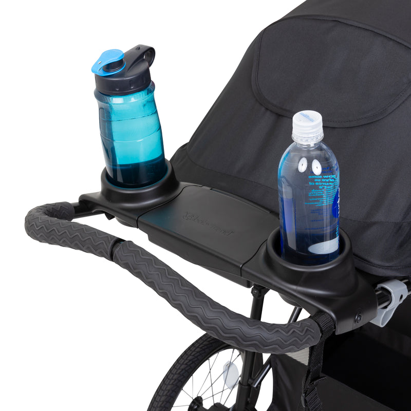 Parent console with two cup holders and covered storage from the Baby Trend Expedition DLX Jogger Stroller