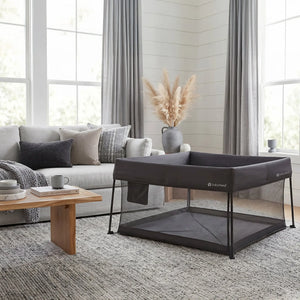 The Baby Trend Play Zone Play Space is inside a living room of a family home