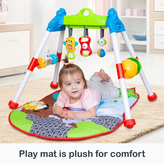 Baby on activity mat with hanging toys