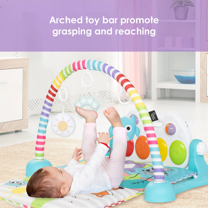 Baby exploring activity mat independently