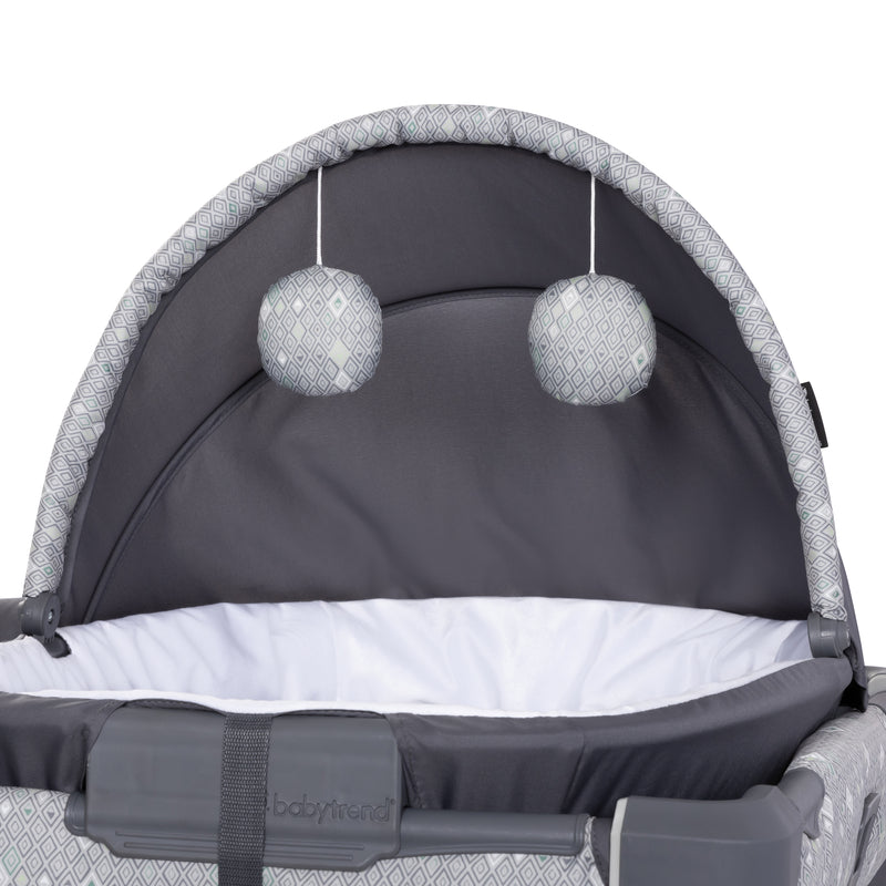 Baby Trend Nursery Den Rocking Cradle with two hanging toy
