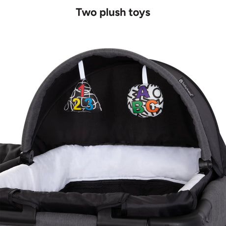 Baby Trend Willow Nursery Center Playard two plush toys on the napper