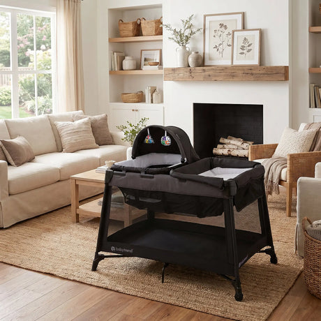 The Baby Trend Willow Nursery Center Playard is set in the living room of a home
