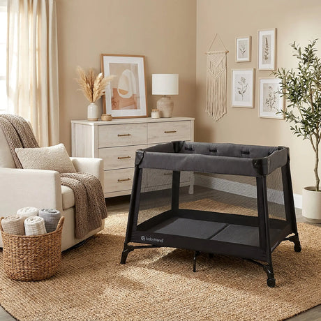 The Baby Trend Willow Nursery Center Playard is set in the room of a home