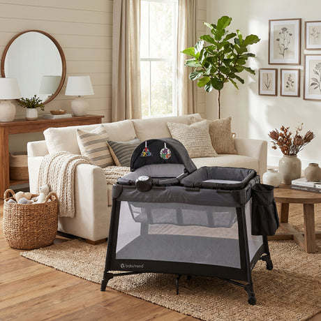 The Baby Trend Willow Nursery Center Playard is set in the living room of a well decorated home