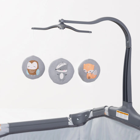 Three hanging round toys from the Baby Trend EZ Rest Playard