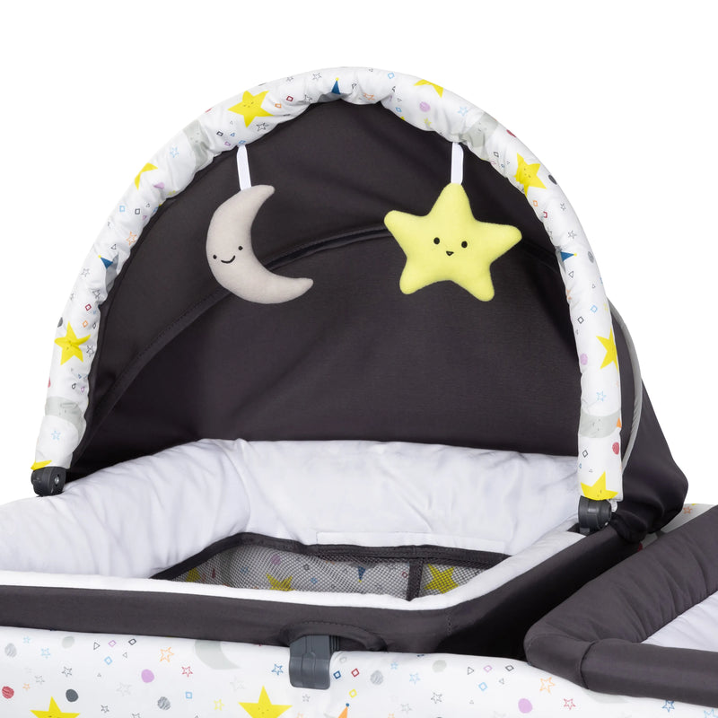 Baby Trend Nursery Center Playard canopy with two hanging toys on the napper