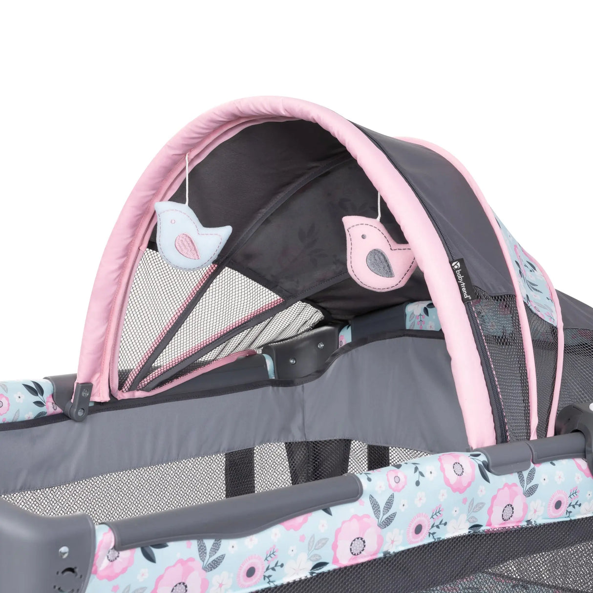 The canopy of the Baby Trend Deluxe II Nursery Center Playard has two hanging toys