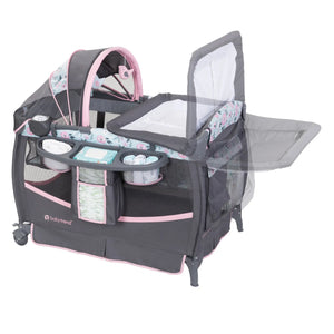 Baby Trend Deluxe II Nursery Center Playard showing the changing table can be rotated out of the way