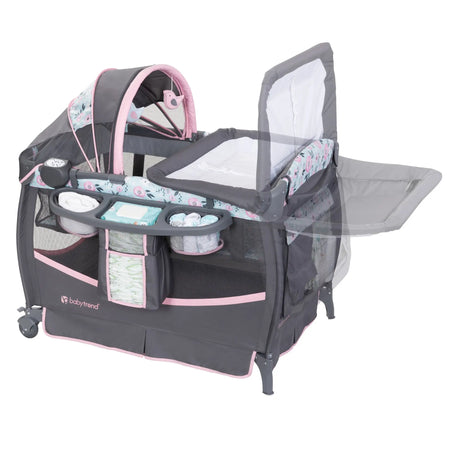 Baby Trend Deluxe II Nursery Center Playard showing the changing table can be rotated out of the way