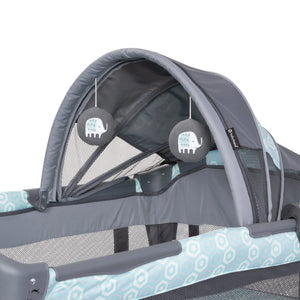 Canopy with two hanging toys on the Baby Trend EZ Rest Deluxe Nursery Center