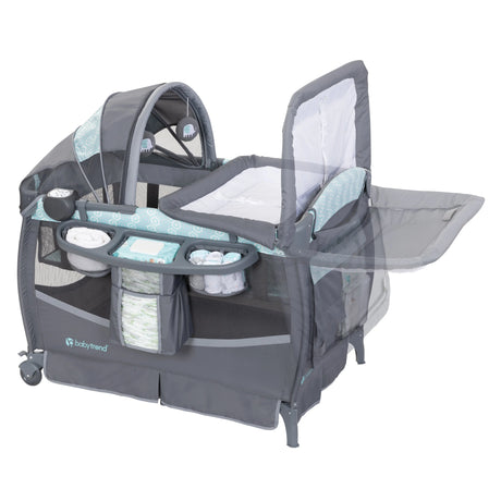 The changing table can flip away on the Baby Trend EZ Rest Deluxe Nursery Center