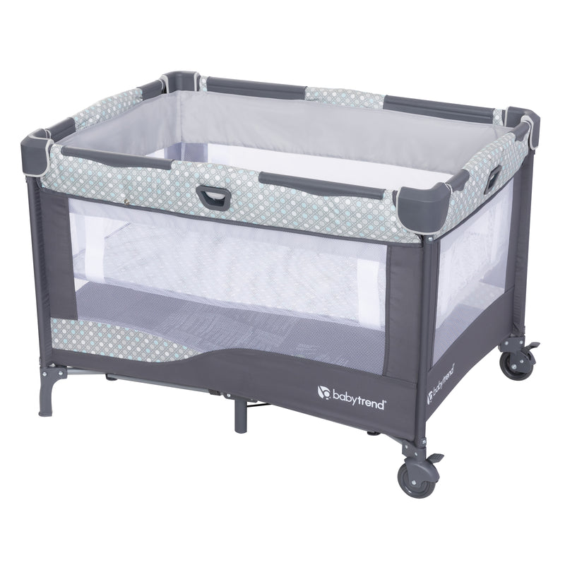 View of the playard with the full-size bassinet attached of the Baby Trend Nursery Den Playard with Rocking Cradle