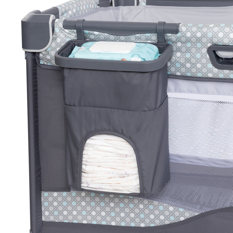 Parent diaper organizer included with the Baby Trend Nursery Den Playard with Rocking Cradle