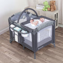 Load image into gallery viewer, A child laying on the changing table of the Baby Trend EZ Rest Deluxe Nursery Center Playard