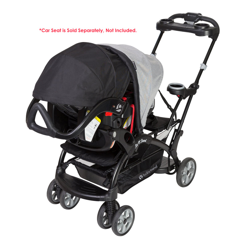 Baby Trend Sit N' Stand Ultra Stroller with an infant car seat in front, sold separately