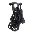 Load image into gallery viewer, Compact fold of the Baby Trend Passport Carriage Stroller