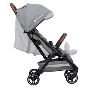 Side view of the Baby Trend Zenda Compact All-Terrain Stroller child's seat reclined and foot rest adjusted