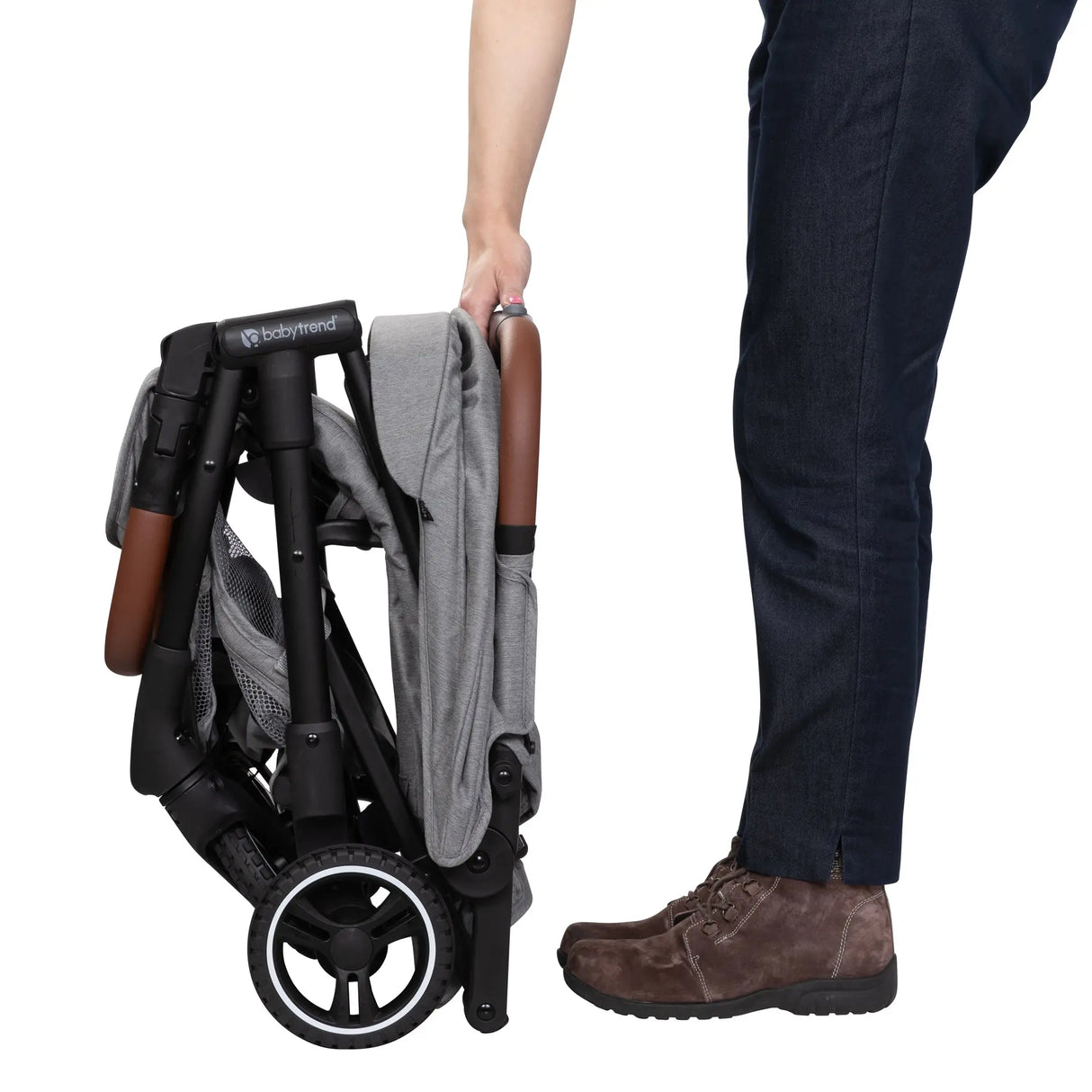 A person just folded the Baby Trend Zenda Compact All-Terrain Stroller