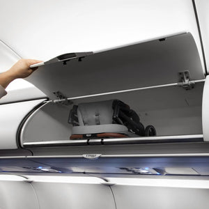 The Baby Trend Zenda Compact All-Terrain Stroller is folded and placed in a plane bin 