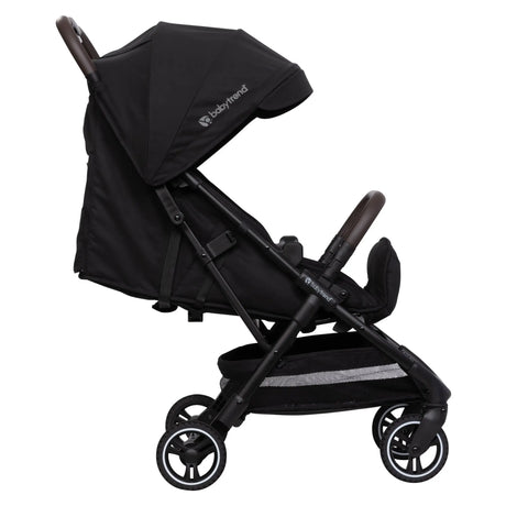 Side view of the Baby Trend Zenda Compact All-Terrain Stroller child's seat reclined and foot rest adjusted