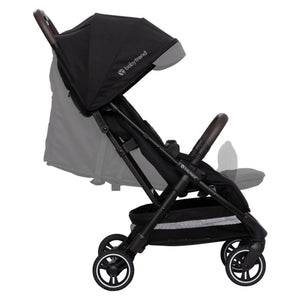 Side view of the Baby Trend Zenda Compact All-Terrain Stroller child's seat reclined and foot rest adjusted