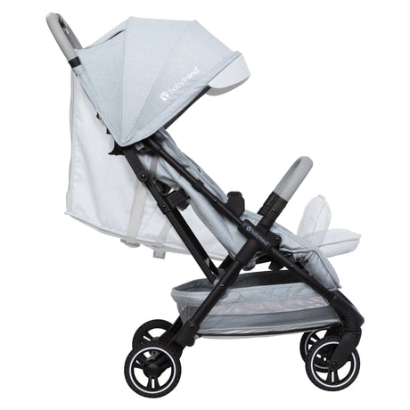 Side view of the Baby Trend Zenda Compact All-Terrain Stroller with the child's seat reclined