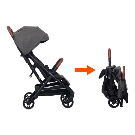 Side view of the Baby Trend Sonar Compact Lightweight Stroller being folded