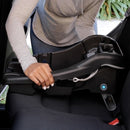 Load image into gallery viewer, A mom is installing the Baby Trend EZ-Lift PLUS Infant Car Seat base into her car