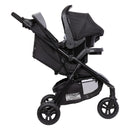 Load image into gallery viewer, Side view of the Baby Trend Passport Seasons All-Terrain Stroller Travel System with an infant car seat attached