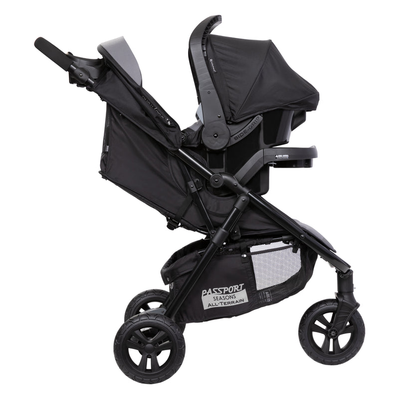Side view of the Baby Trend Passport Seasons All-Terrain Stroller Travel System with an infant car seat attached